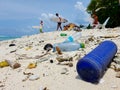 CLOSE UP: A group of surfboarders head out to the ocean down a dirty beach. Royalty Free Stock Photo