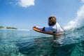 Local Maldivian surfer rides the ocean wave