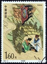 HINA - CIRCA 1992: A stamp printed in China shows Zhuge Liang and Lu Su in straw-covered boat under arrow attack, circa 1992.