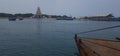 Hindhu temple in island and boats are in sea .