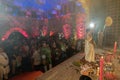 Hindu Bengali devotees praying to Goddess Durga while Purohit worshipping Goddess. Ashtami puja aarati - sacred Durga Puja ritual Royalty Free Stock Photo