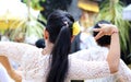 Hindu celebration at Bali Indonesia, religious ceremony with yellow and white colors, woman dancing. Royalty Free Stock Photo