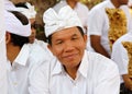 Hindu celebration at Bali Indonesia, religious ceremony with yellow and white colors, woman dancing.