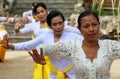 Hindu celebration at Bali Indonesia, religious ceremony with yellow and white colors, woman dancing.