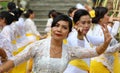 Hindu celebration at Bali Indonesia, religious ceremony with yellow and white colors, woman dancing. Royalty Free Stock Photo