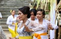 Hindu celebration at Bali Indonesia, religious ceremony with yellow and white colors, woman dancing. Royalty Free Stock Photo