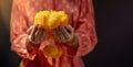 Hindu Ceremonies, Rituals, Spirituality, Religion and Hope Concept. Woman Holdings Marigold Flowers , Respect and Surrender.
