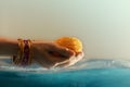 Hindu Ceremonies, Rituals, Spirituality, Religion and Hope Concept. Woman Holdings Marigold Flowers in Water , Respect and