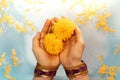 Hindu Ceremonies, Rituals, Spirituality, Religion and Hope Concept. Woman Holdings Marigold Flowers in Water , Respect and