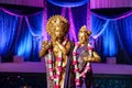 Hindu Deities in front of mandap at Indian wedding