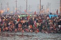 Hindu devotees come to confluence of the Ganges for holy dip during the festival Kumbh Mela Royalty Free Stock Photo