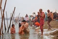 Hindu devotees come to confluence of the Ganges River for holy dip during the festival Kumbh Mela Royalty Free Stock Photo