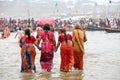 Hindu devotees come to confluence of the Ganges River for holy dip during the festival Kumbh Mela Royalty Free Stock Photo