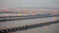 Hindu devotees crossing the pontoon bridges over the Ganges River at Maha Kumbh Mela festival Royalty Free Stock Photo