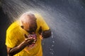 Hindu Devotees Performing Ritual Bath During Thaipusam Festival