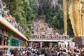 Hindu devotees walking up stairs at Thaipusam Festival Batu Caves KL