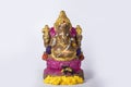 The Hindu Festival Ganesh Chaturthi is celebrated by placing flowers on a beautiful Ganesh statue made of clay on a white