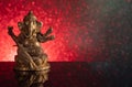 Hindu God Ganesha on a red and black gradient background with stars