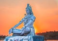 Hindu god lord shiva statue in meditation posture with dramatic sky at evening from unique angle Royalty Free Stock Photo