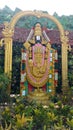 Hindu god lord venkateswara statue with full of greenery