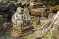 Hindu god mossy stone statue. Angkor Wat temple, Cambodia. Vishnu god statue. Ancient temple ruin in Siem Reap.