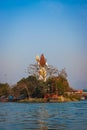 Hindu god shiva statue from back with bright blue sky background at morning different angle Royalty Free Stock Photo