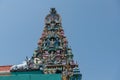 Hindu god statue by roof at Sri Mariamman Temple, Singapore