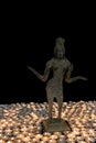 Hindu Goddess Lakshmi bronze statue by candlelight. Many candle Royalty Free Stock Photo