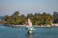 Hindu goddess statue in the middle of ganges river with flat sky
