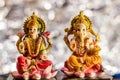 Hindu Gods concept with Ganesha and Laxmi idols with bright background