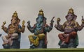 Hindu gods represented in colorful idols at a temple