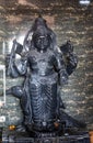hindu holy black stone shani dev idol placed inside traditional temple Royalty Free Stock Photo