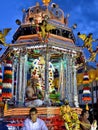 Hindu holy man on decorated palanquin