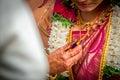 Closeup of Mangal Sutra or Thaali of an Indian Hindu Bride wearing garland and golden jewelry