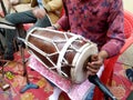 Hindu man play drums,a musical instrument in a religious gathering