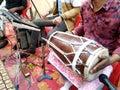 Hindu man play drums,a musical instrument in a religious gathering