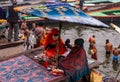 A Hindu Monk sitting on the bank of Ganges river in Varanasi Ghat during Kumbha mela. Benaras Utrar Pradesh India 01/05/2024 Royalty Free Stock Photo