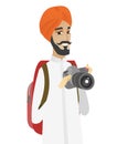 Hindu nature photographer with digital camera.