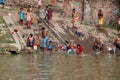 Hindu people bathing in the ghat near the Dakshineswar Kali Temple in Kolkata Royalty Free Stock Photo