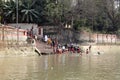 Hindu people bathing in the ghat near the Dakshineswar Kali Temple in Kolkata Royalty Free Stock Photo