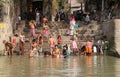 Hindu people bathing in the ghat near the Dakshineswar Kali Temple in Kolkata, India Royalty Free Stock Photo