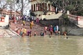 Hindu people bathing in the ghat near the Dakshineswar Kali Temple in Kolkata Royalty Free Stock Photo