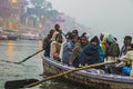 Hindu people in a boat on river