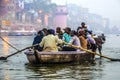 Hindu people in a boat on river