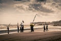 Hindu people celebrating with a traditional party on a beach in Bali. Traditional wedding party