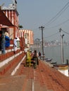 Hindu pilgrims climb the steps of a Shiva temple