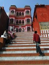 Hindu pilgrims climb the steps of a Shiva temple