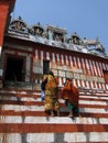 Hindu pilgrims climb the steps of a Shiva temple