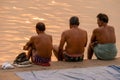 Hindu pilgrims preparing to bathe in the Ganges River in Varanasi at dawn.