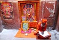 Hindu piligrim sadhu praying on the street in Indi